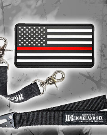 American flag patch with thin red line on a gray background, accompanied by a lanyard with a keychain.
